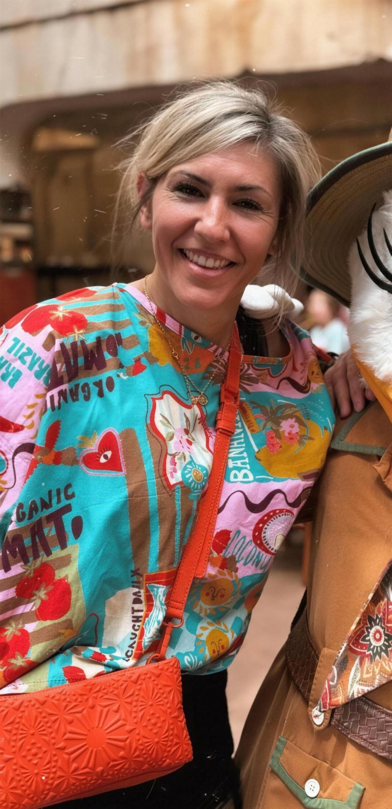 Tanina Jackson smiling in a bright printed top